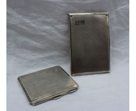 A George V silver cigarette case, of rectangular form with engine turned decoration, initialled JSL, Birmingham, 1936, togeth