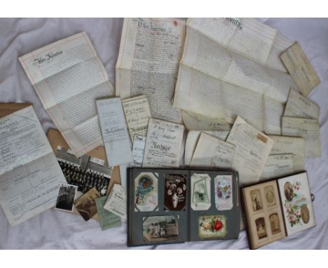 A postcard album containing circa 150 cards including greetings cards, portrait cards, shipping, bands, comic cards, scenic c