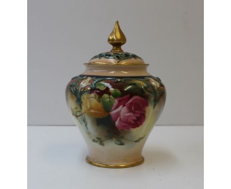 A Royal Worcester porcelain pot pourri vase and cover, the cover with a pointed gilt finial and pierced top, the vase with se