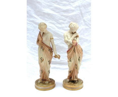 A pair of Royal Worcester figures, Love & Sorrow modelled as half naked young ladies with floral robes, one kissing a dove, t