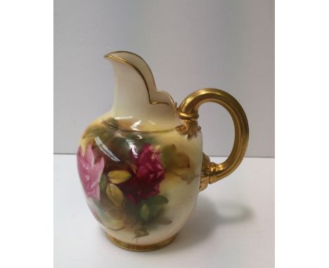 A Royal Worcester porcelain flatback jug, painted with roses and leaves to a blush ivory ground, puce mark and date code for 