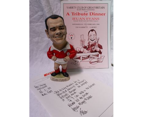 A John Hughes resin grogg of Ieuan Evans, the figure wearing a Wales rugby kit, signed by Ieuan Evans and John Hughes dated '