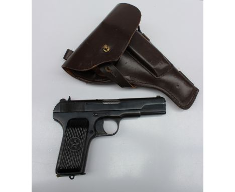 A deactivated Russian Tokarev TT-33 7.62mm semi automatic pistol, dated 1952, Sn - 1285 complete with 2 magazines which both 