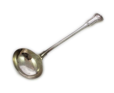 An antique George III Sterling Silver soup ladle by Paul Storr, London 1816. In hourglass pattern, with shell-back decoration