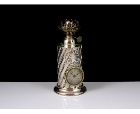An antique Victorian Sterling Silver oil lamp / clock, by James Deakin & Sons, Sheffield 1889. Height 19.5cm / 7.75â€.