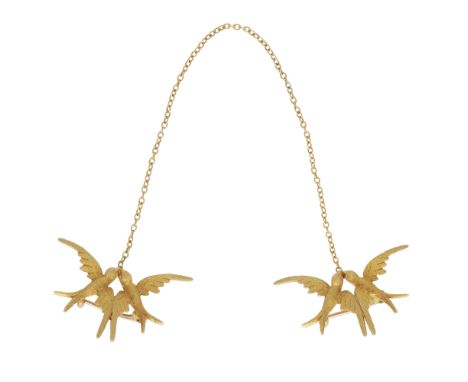An antique late Victorian double bird brooch in 15ct yellow gold, the two halves each depicting a pair of swallows in flight,