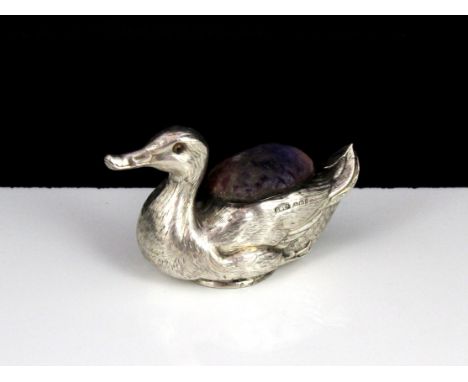 An antique Edwardian Sterling Silver animal pin cushion by Searle & Co, Birmingham 1906. Of novelty form, modeled as a duck w