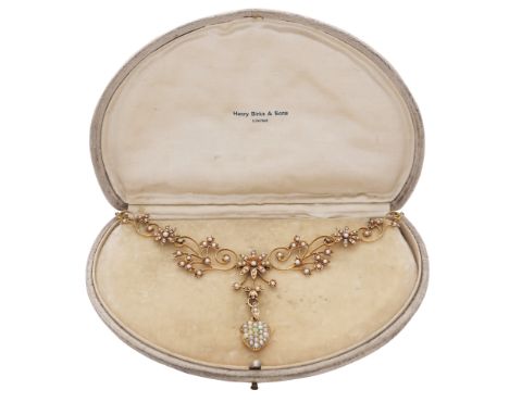 An antique 19th Century green garnet and seed pearl necklace in 14ct yellow gold, stamped 14K and BIRKS. The floral spray des