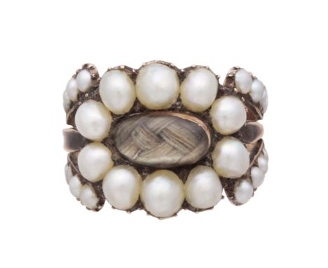 An antique Georgian pearl mourning ring in yellow gold, with an inset panel of woven hair surrounded by a border of seed pear