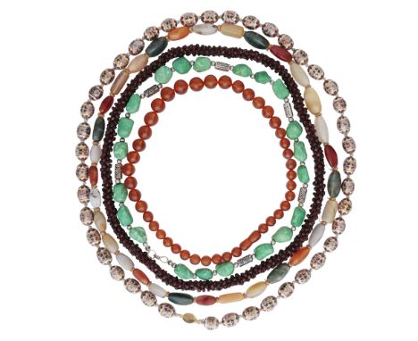 A selection of various hardstone bead necklaces including two garnet necklaces, a set of amber coloured beads, and other exam