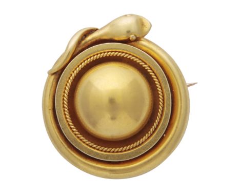 An unusual antique late Victorian mourning brooch in high carat yellow gold, of circular form with a rope twist border, surro