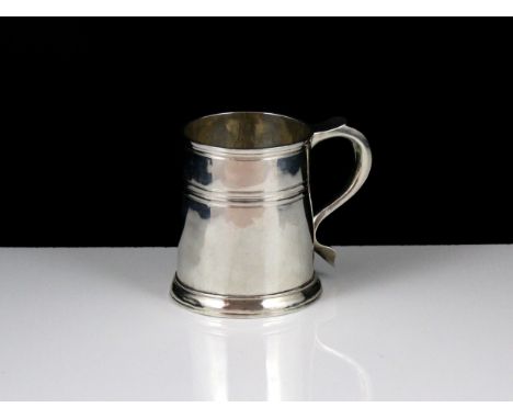 An Antique Queen Anne Britannia Silver mug by Seth Lofthouse, London 1708. The tapering, straight sided body with bands of de
