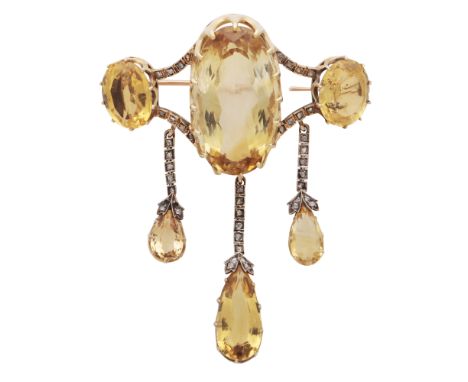 An antique late Victorian cirtine and diamond brooch in yellow gold, apparently unmarked, the large central oval cut citrine 