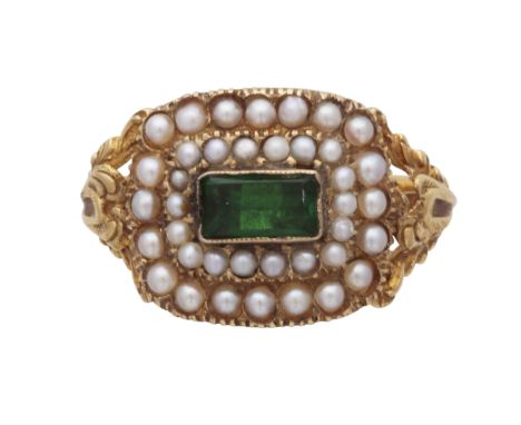 An antique William IV emerald and pearl mourning ring in 18ct yellow gold, hallmarked 1836. The rectangular cut emerald surro