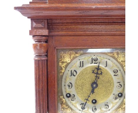 An Edwardian oak-cased mantel clock, square brass dial and 3-train movement, height 40cm 
