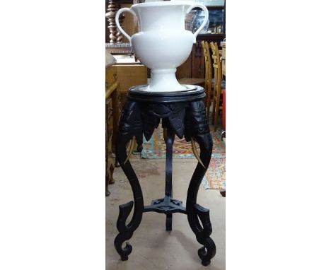 An Indian design ebonised jardiniere stand, with elephant supports, inset marble top, W35cm, H77cm, together with a white cer