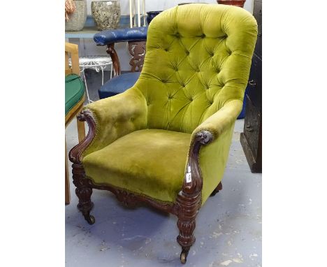 A William IV mahogany button-back upholstered armchair, on turned legs 