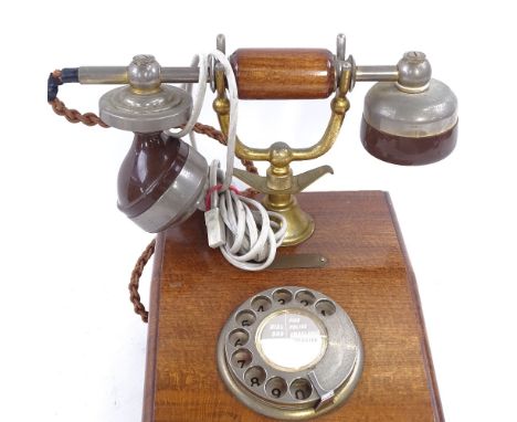 A Vintage stained wood-cased dial telephone 
