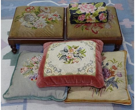 A pair of Victorian mahogany button footstools, with needlework upholstery 