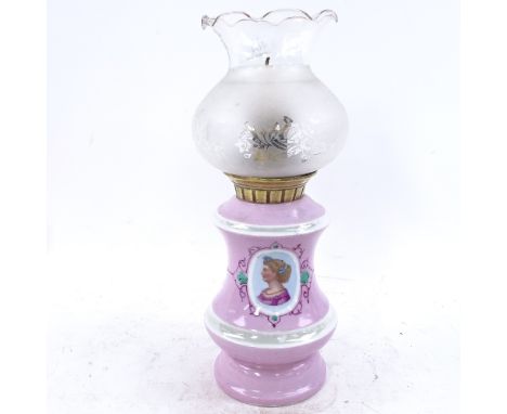 A 19th century pink and white ceramic oil lamp converted to candle holder, with frosted frilled glass shade, height 33cm 