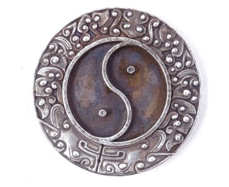 A Chinese unmarked white metal yin and yang brush washer tablet, with seal mark on base, diameter 8.5cm 