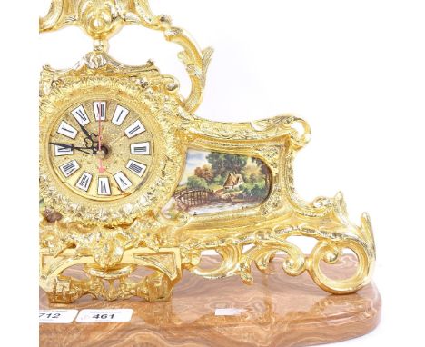 A modern brass quartz mantel clock, on shaped agate base, base length 40cm 