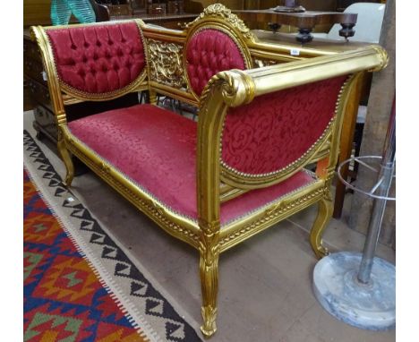 An ornate giltwood and button-back upholstered salon settee on cabriole legs, L156cm 