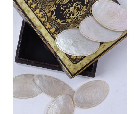 A set of carved mother-of-pearl gaming counters, and a lacquered and gilded Oriental box 
