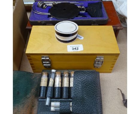 Boxed brass Avery weights, a wallet with glass medicine tubes, a mahogany scale and weights, and a cased set of dental examin