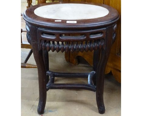 A Chinese oval padauk wood lamp table, with inset marble top with carved and pierced frieze, W42cm H49cm 