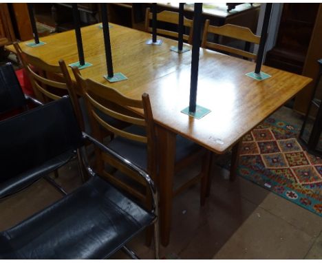 A Gordon Russell for Heals teak extending dining table (1 spare leaf), together with a set of 4 matching ladder-back chairs 