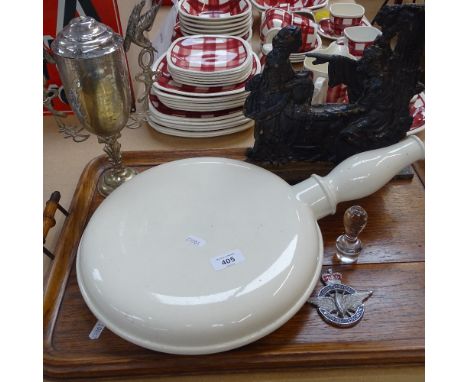 An oak tea tray, a bed pan, a cast-iron doorstop, height 27cm, a plated Hong Kong urn and cover with inscription, and a Civil