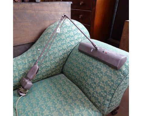 An American metal wall-mounted anglepoise lamp, label for Dazor Manufacturing Group St Louis 