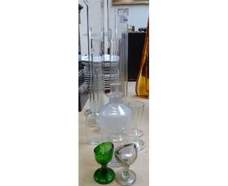 3 Antique glass measures with engraved numbers, 6 other measures, a bottle and 2 Vintage eye baths 
