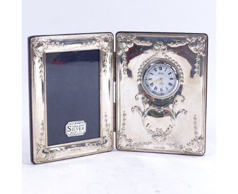 A modern silver combination folding photo frame, and clock 