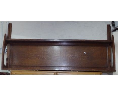 An Arts and Crafts oak hanging shelf, W153cm 