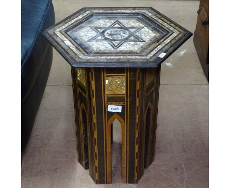 An Islamic octagonal hardwood occasional table, with mother-of-pearl inlaid decoration, W40cm, H47cm 