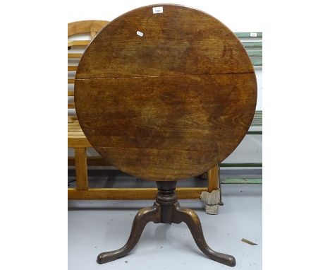 A Georgian oak tilt-top table, on tripod base, W76cm 