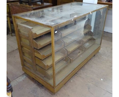 A Vintage oak-framed shop haberdashery cabinet, fitted with 15 graduated drawers, W122cm, H81cm, D59cm 