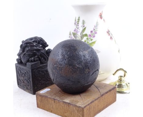 A cannonball on fitted oak stand, a Poole Pottery vase, 21cm, and a Chinese seal with dragon decoration 