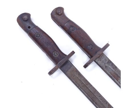 2 First War Period Wilkinson's 1907 pattern sword bayonets, 1 in original leather scabbard, blade length 43cm (2) 