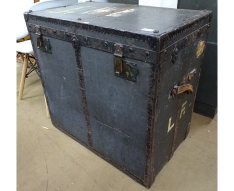 A Vintage steel-bound travelling trunk, label for J Burton &amp; Brothers, W74cm, H71cm 