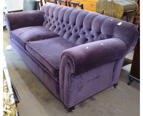 An early 20th century upholstered button-back 3-seater settee (originally a drop-arm settee?), L210cm 