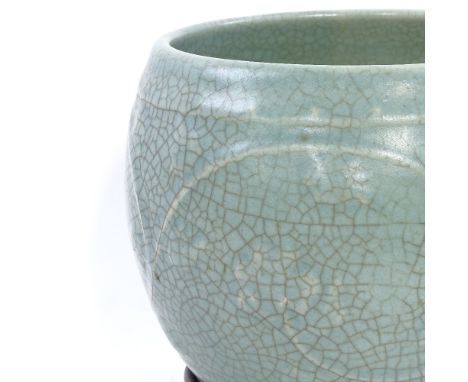 A Chinese celadon crackle glaze ceramic jardiniere, on hardwood stand, overall height 20cm, rim diameter 18cm 