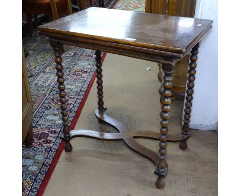 A small oak fold over table, on bobbin turned legs, W61cm, H65cm 
