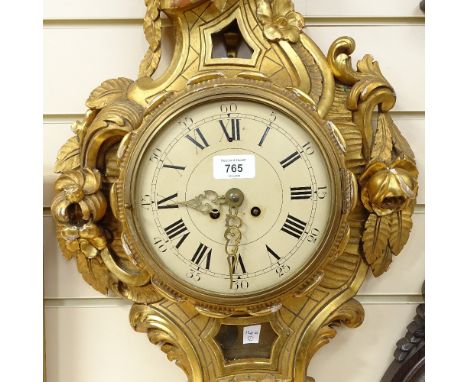 A Rococo style carved and gilded wood-cased wall clock, with painted metal dial, probably early 20th century, height 67cm 