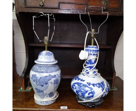 A Chinese design blue and white table lamp, on hardwood stand, and a Chinese design blue and white baluster vase design table