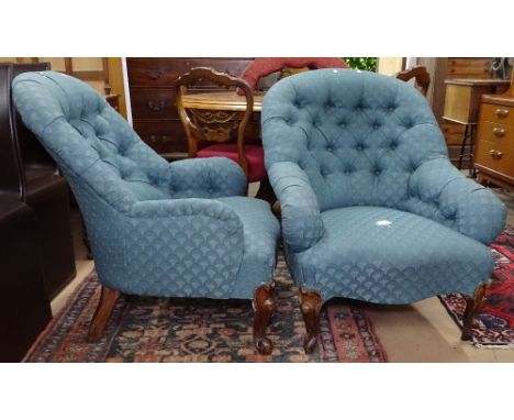 A pair of Victorian button-back upholstered armchairs 