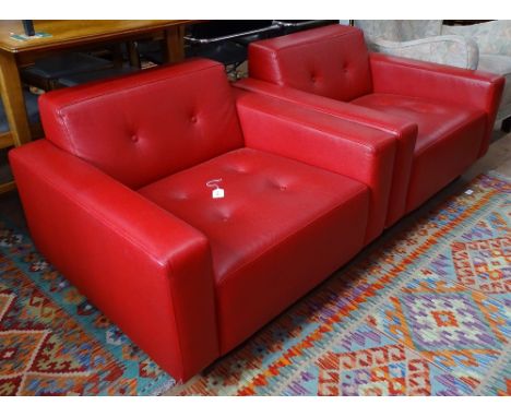 A pair of Hitch Mylus HM46. Red leather lounge chairs on wooden sled base with sewn in makers label to rear.