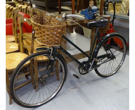 A Vintage Lady's Triumph bicycle with wicker basket 